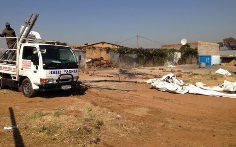 IEC Officials rebuilding a tent that was burnt during protests in Freedom Park (Soweto) last night. Masego Rahlaga/EWN