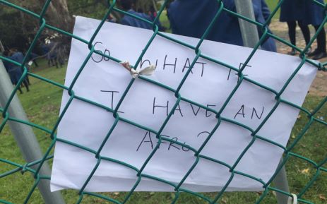 Learners at Sans Souci Girls High placed posters against a fence during a demonstration against alleged practices at their school. Picture: Monique Mortlock/EWN.