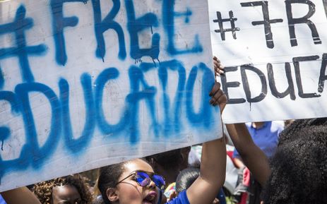 Demonstrating students hold up placards during protests over tertiary education fees in Pretoria on 10 October 2016. Picture: Reinart Toerien/EWN.