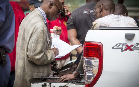 Suspects involved in a shooting on Katherine Street near Grayston Drive are questioned by police. Picture: Thomas Holder/EWN