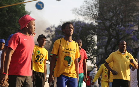 Students prepare to face off with police in the streets of Pretoria during protests over a proposed university tuition fee increases on 23 October 2015. Picture: Reinart Toerien/EWN