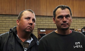 Theo Martins (left) and Willem Oosthuizen appear in court at the Middleburg magistrates high court, in Mpumalanga province.