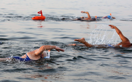 Participants take part in a 18-kilometre swim from Jordan to Israel across the Dead Sea, organised by the EcoPeace charity aimed at raising awareness for the iconic water body which has been receding by roughly a metre each year, on  15 November.