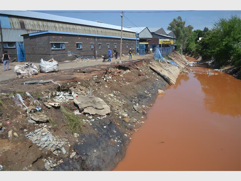 The concrete, which had been put on the banks of the Eastleigh Spruit, was ripped off during the flooding of November 9. The concrete was put down between Central Avenue and Plantation Road.