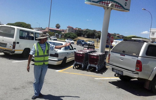 Richard Hugo directing a driver at a parking place