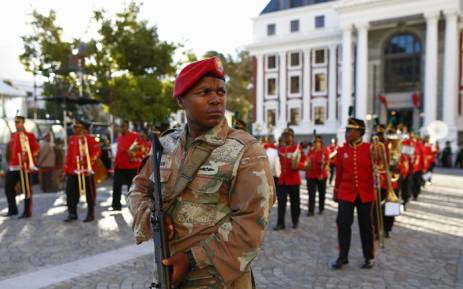 An SANDF soldier patrols in the streets near the Parliament ahead of the arrival of South Africa