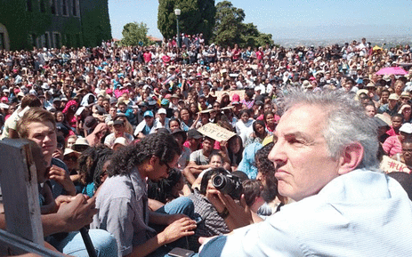 FILE: UCT vice chancellor Max Price sits among students as he listens to their complaints outside Jameson Hall on 22 October 2015 during Fees Must Fall protests. Picture: EWN.