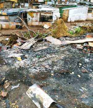 The remains of the home of a family of three that were killed following a fire at Foreman's Road Settlement. (Kaveel Singh, News24)