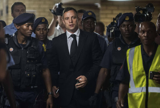 FILE PHOTO: Oscar Pistorius arrives court sentencing