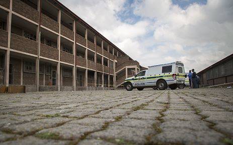 FILE: Police guard a burnt classroom which they cordoned off as a crime scene on 7 September 2016. Picture: EWN.