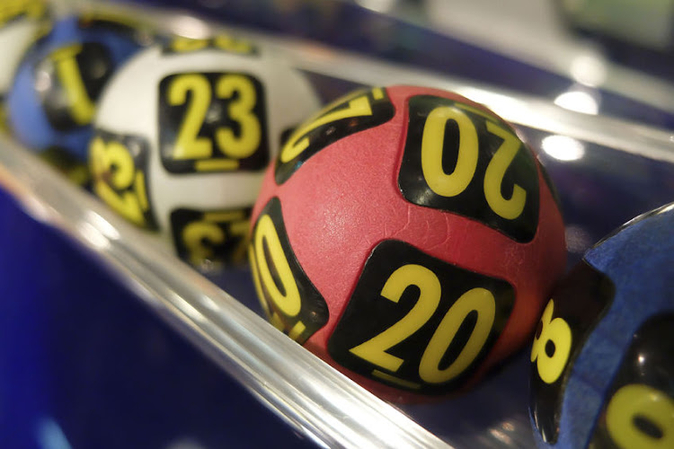 File photo of lotto balls. The secret millionaire's advice for winners is not to make big changes, saying 